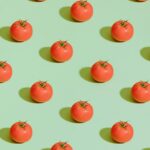 red cherry fruits on pink surface